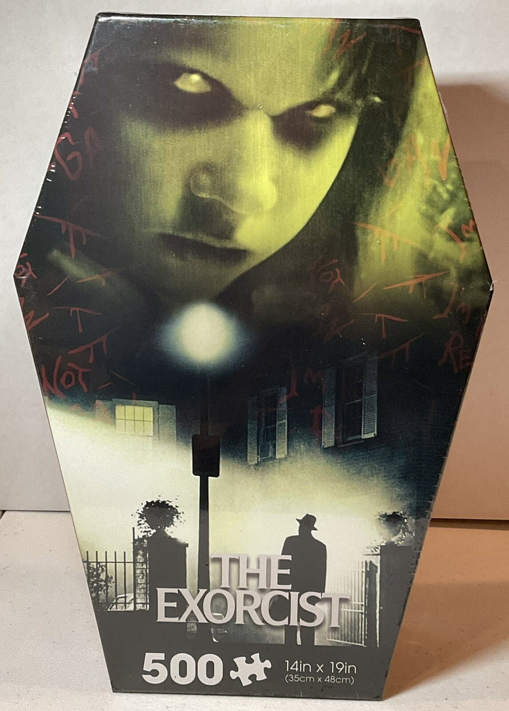 The Exorcist 500 Piece Puzzle Coffin Shaped Box includes Puzzle Art Poster