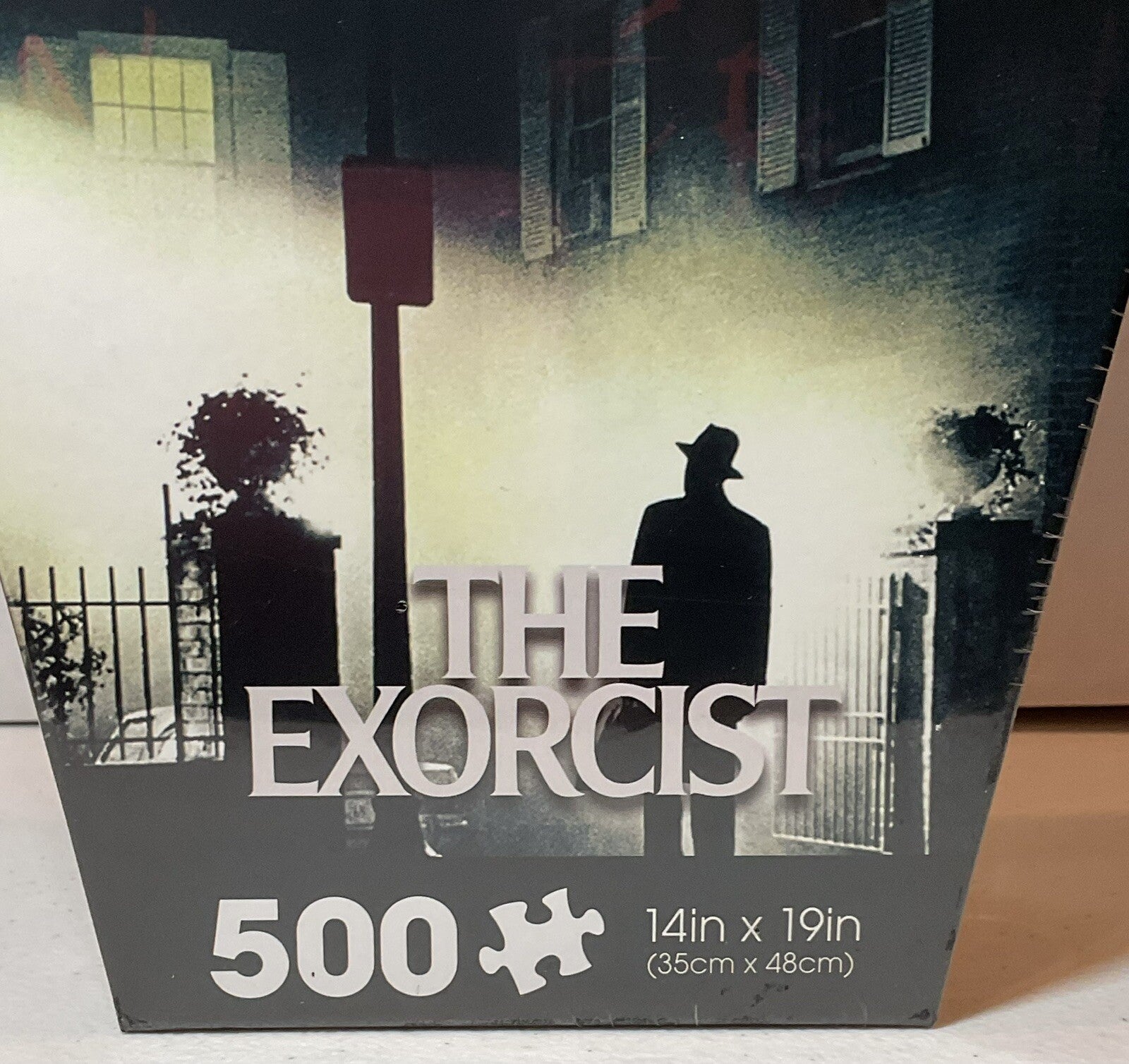 The Exorcist 500 Piece Puzzle Coffin Shaped Box includes Puzzle Art Poster