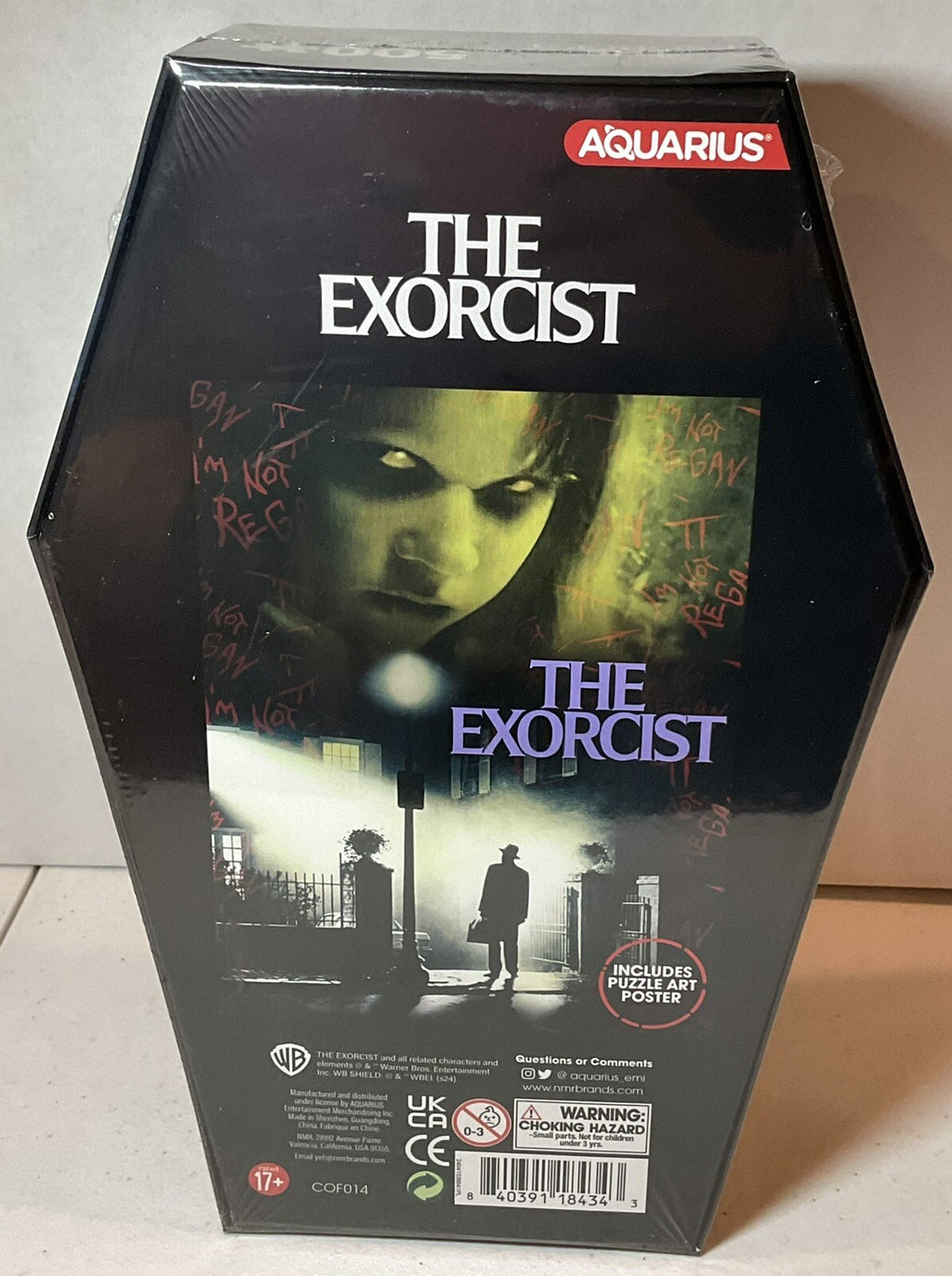 The Exorcist 500 Piece Puzzle Coffin Shaped Box includes Puzzle Art Poster