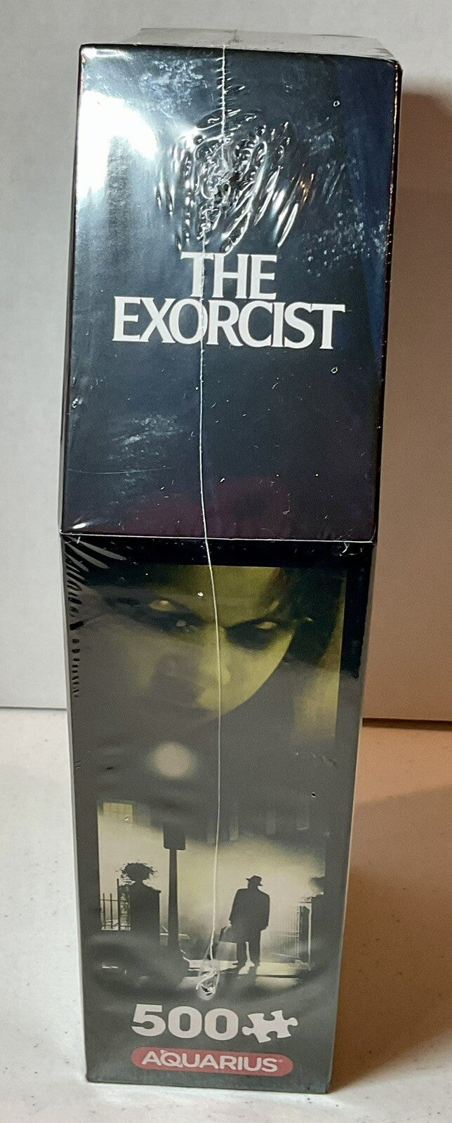 The Exorcist 500 Piece Puzzle Coffin Shaped Box includes Puzzle Art Poster