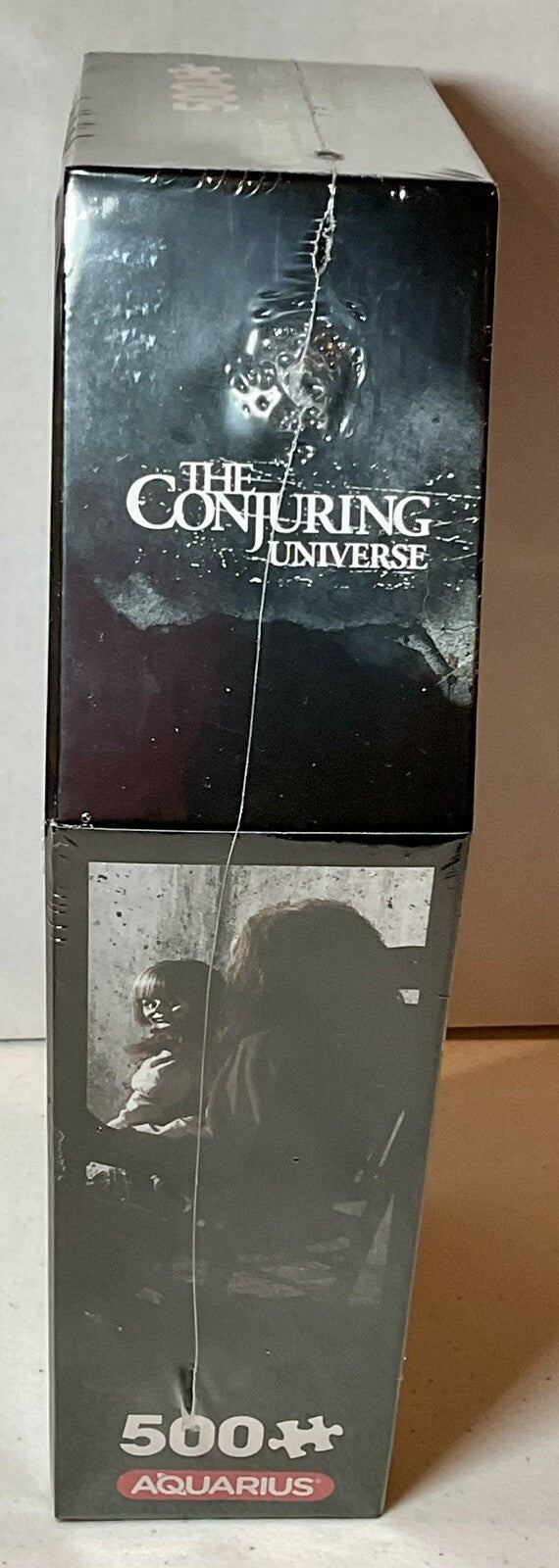 The Conjuring 500 Piece Puzzle Coffin Shaped Box includes Puzzle Art Poster