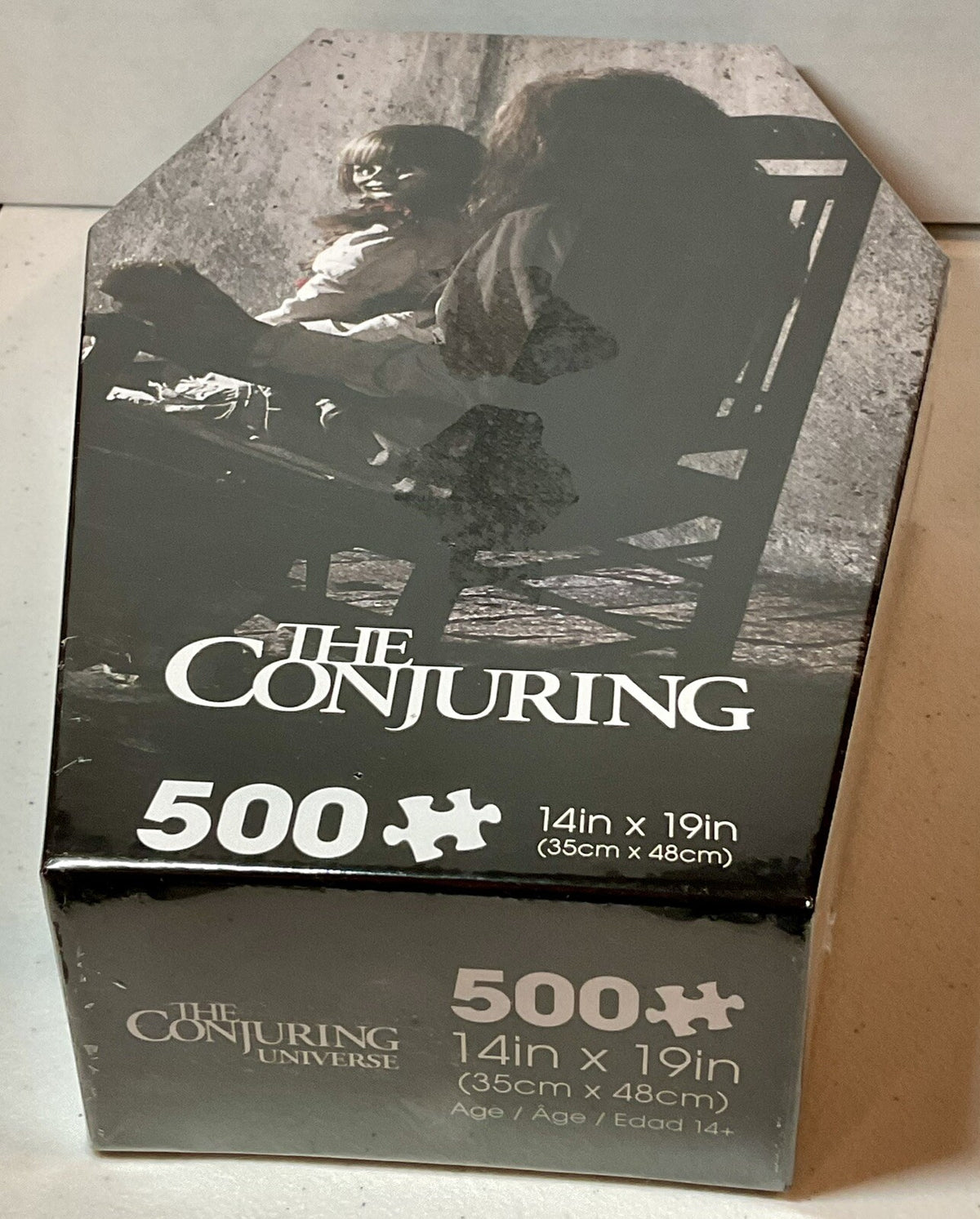 The Conjuring 500 Piece Puzzle Coffin Shaped Box includes Puzzle Art Poster