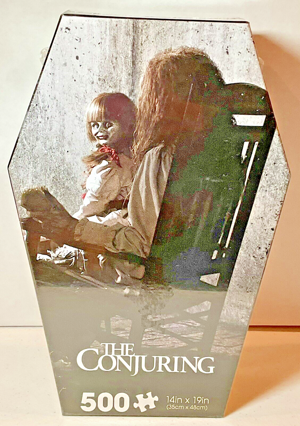 The Conjuring 500 Piece Puzzle Coffin Shaped Box includes Puzzle Art Poster