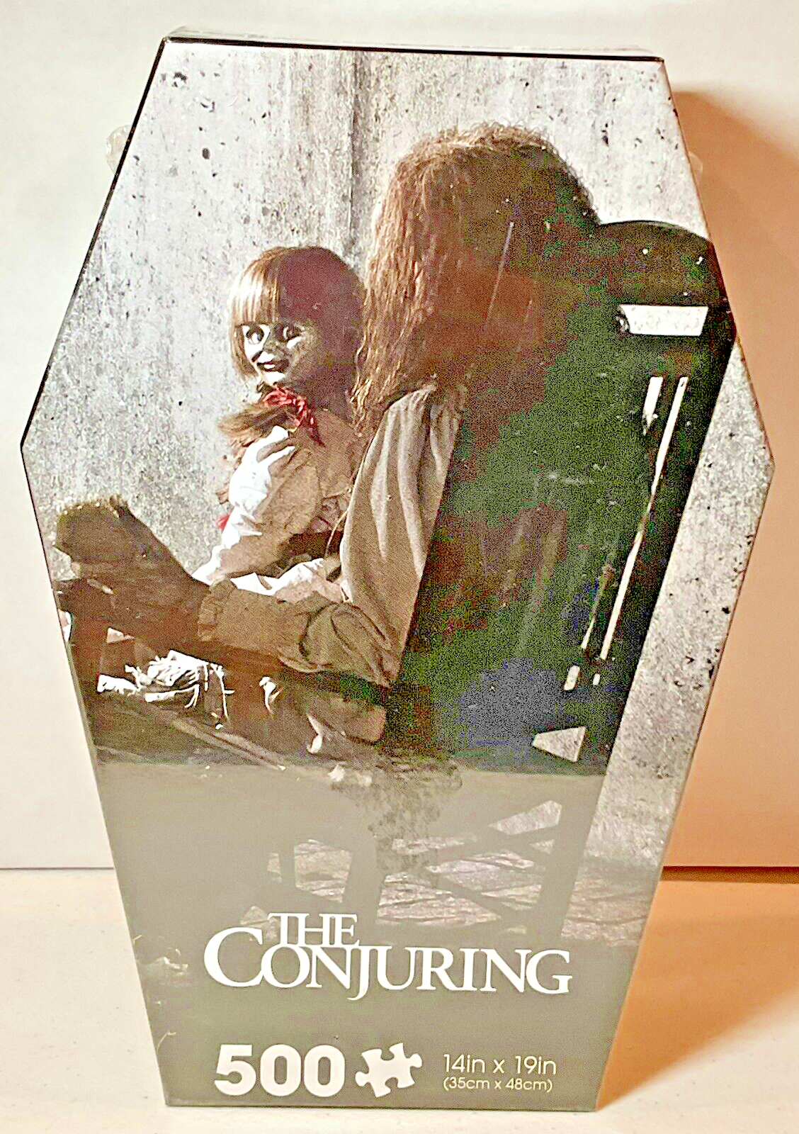 The Conjuring 500 Piece Puzzle Coffin Shaped Box includes Puzzle Art Poster