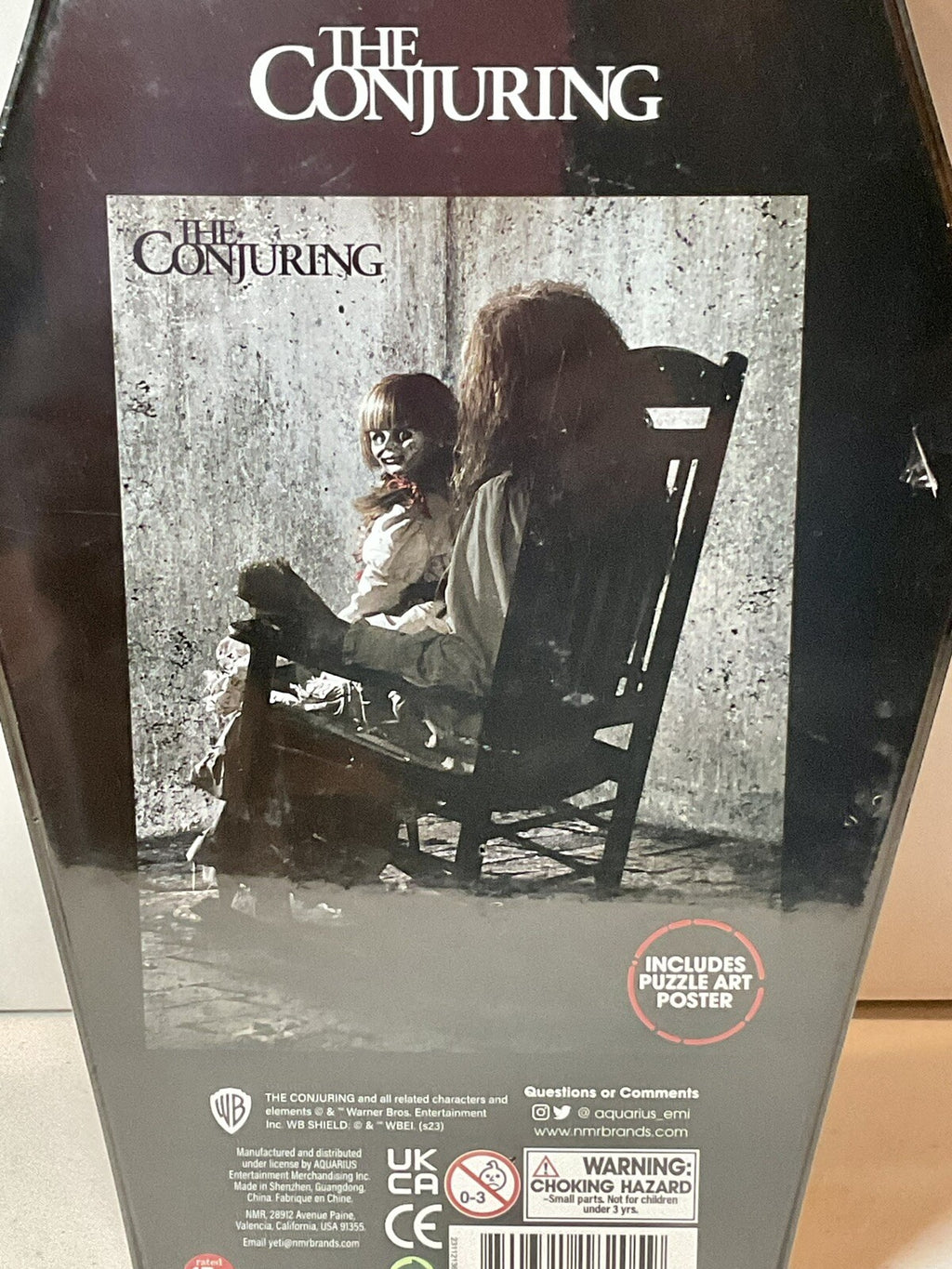 The Conjuring 500 Piece Puzzle Coffin Shaped Box includes Puzzle Art Poster