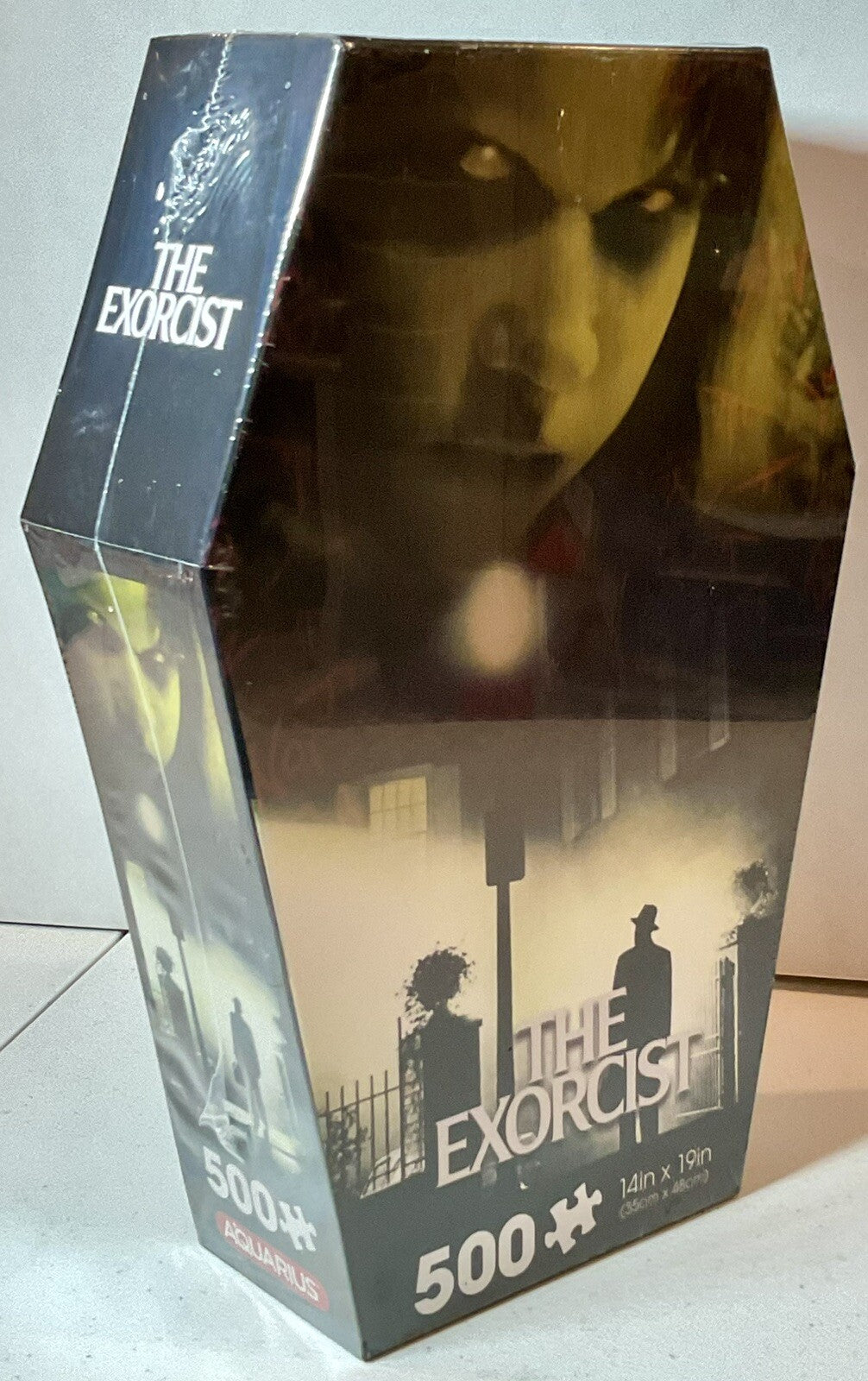 The Exorcist 500 Piece Puzzle Coffin Shaped Box includes Puzzle Art Poster