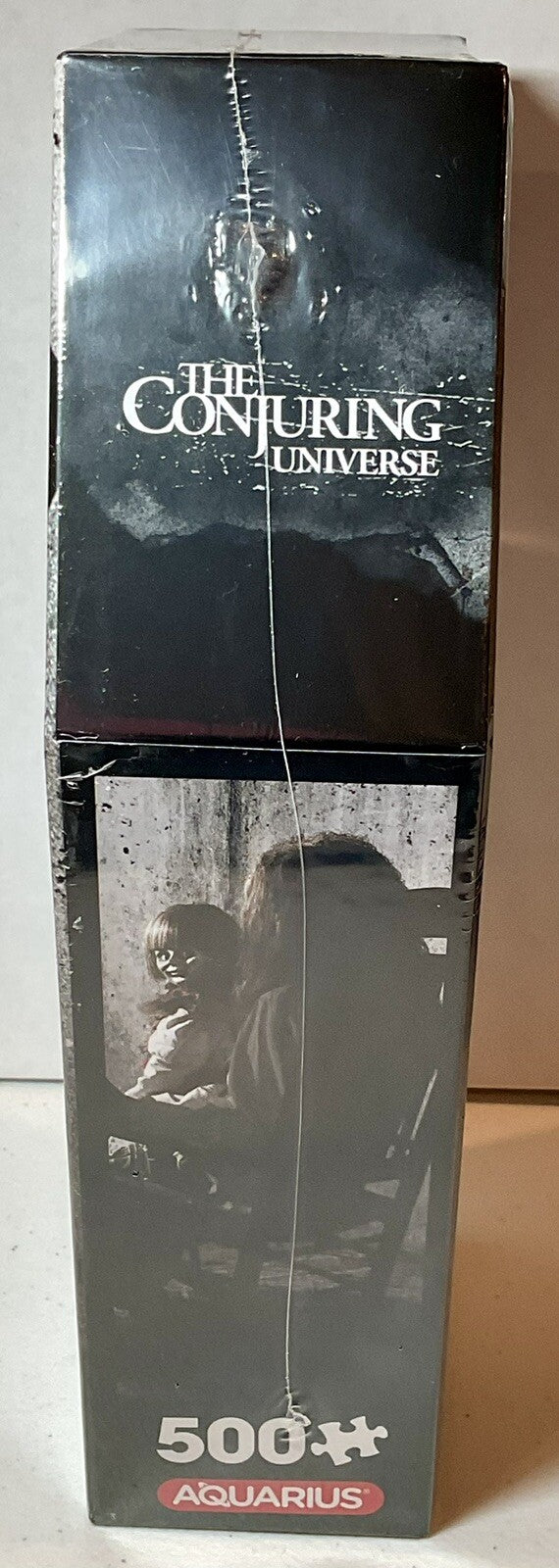 The Conjuring 500 Piece Puzzle Coffin Shaped Box includes Puzzle Art Poster